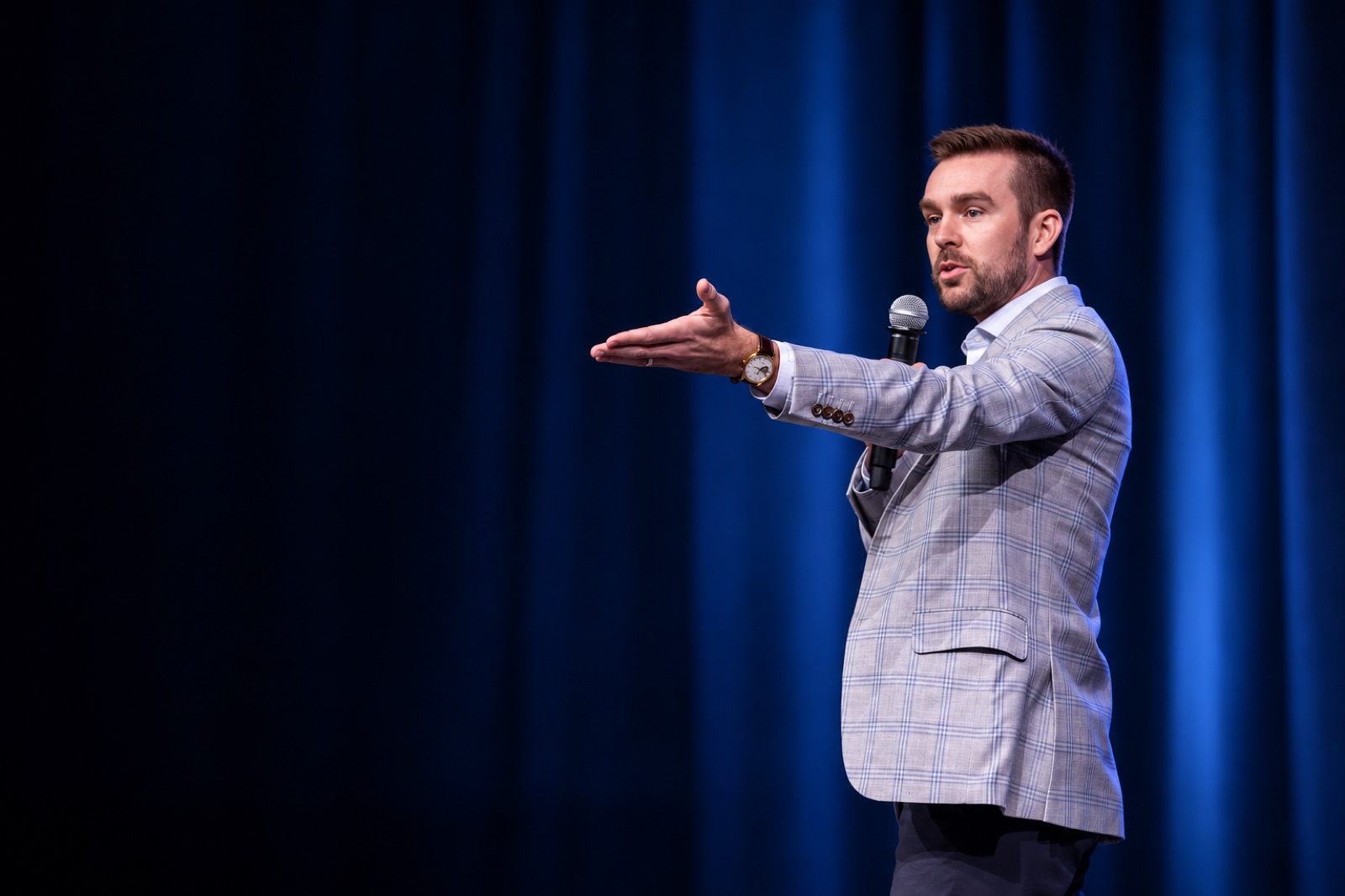 Pierce Dempsey speaking on stage